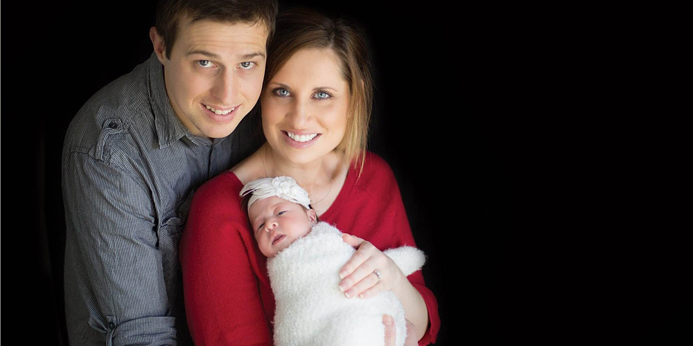 New parents Jodie and Aden with baby Evie