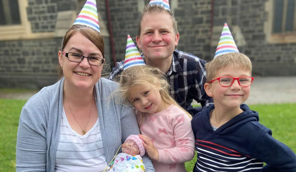 Baby Mylah with her big sister and brother and her mother Jodie and father Raoul enjoying a picnic