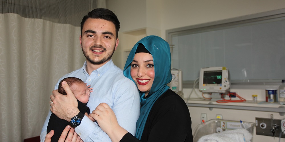 Burak Demir and his wife Sare with their son Yusuf, who was born at the Women's early at 23 weeks 