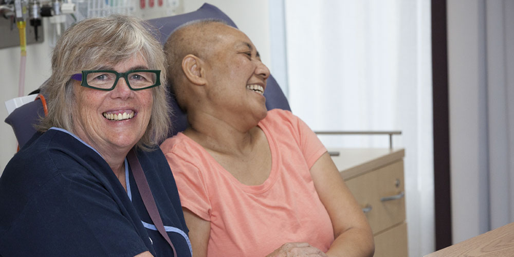 Julene Hallo with chemotherapy patient Nora Talipope