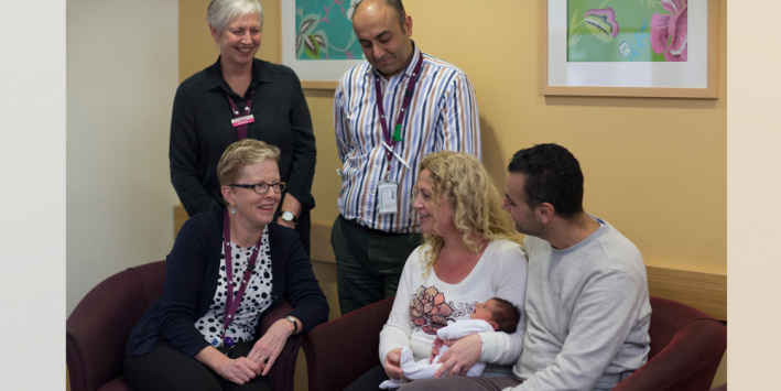 Research staff with with new parents