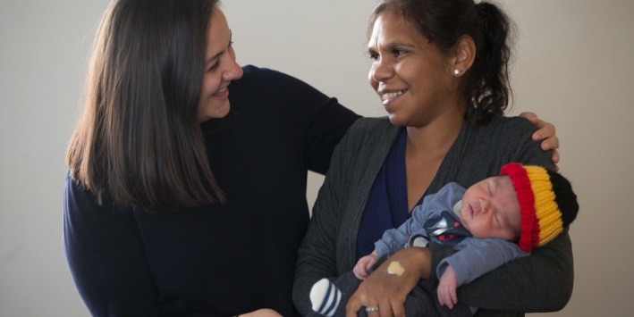 Rosie Wise Britton and her baby Jindara with midwife, Amelia Stephens