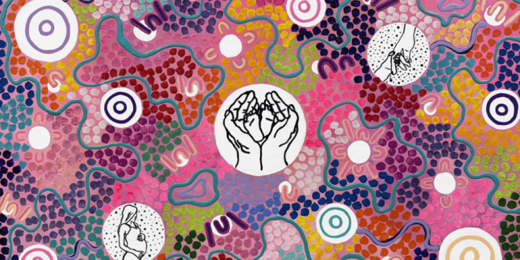 A colourful Aboriginal artwork which has at its centre a circle in which two hands are holding the two feet of a baby.