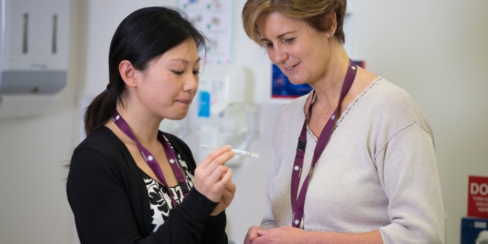 staff discuss HPV research